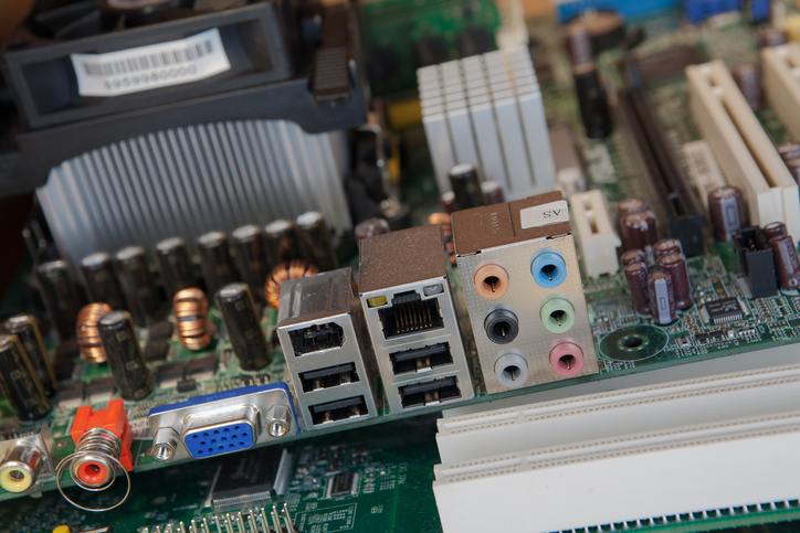 close up view of computer motherboard showing the cable connections